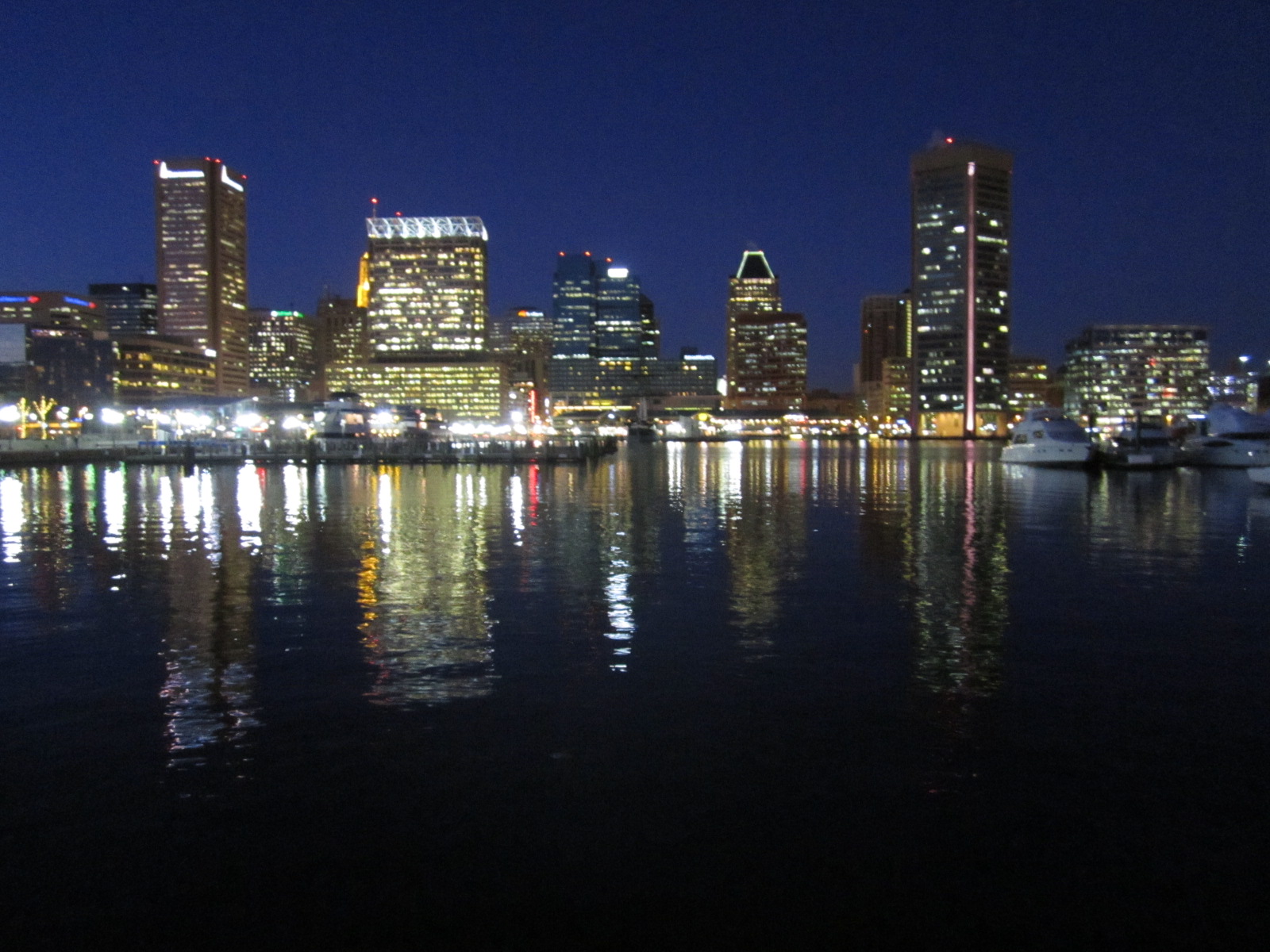 The city skyline glows at Baltimore's Inner Harbor.